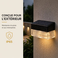 Applique murale extérieure solaire noire IP65 installée sur un mur extérieur